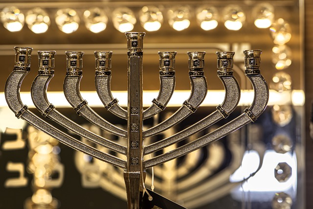 a gold menorah surrounded by golden lights