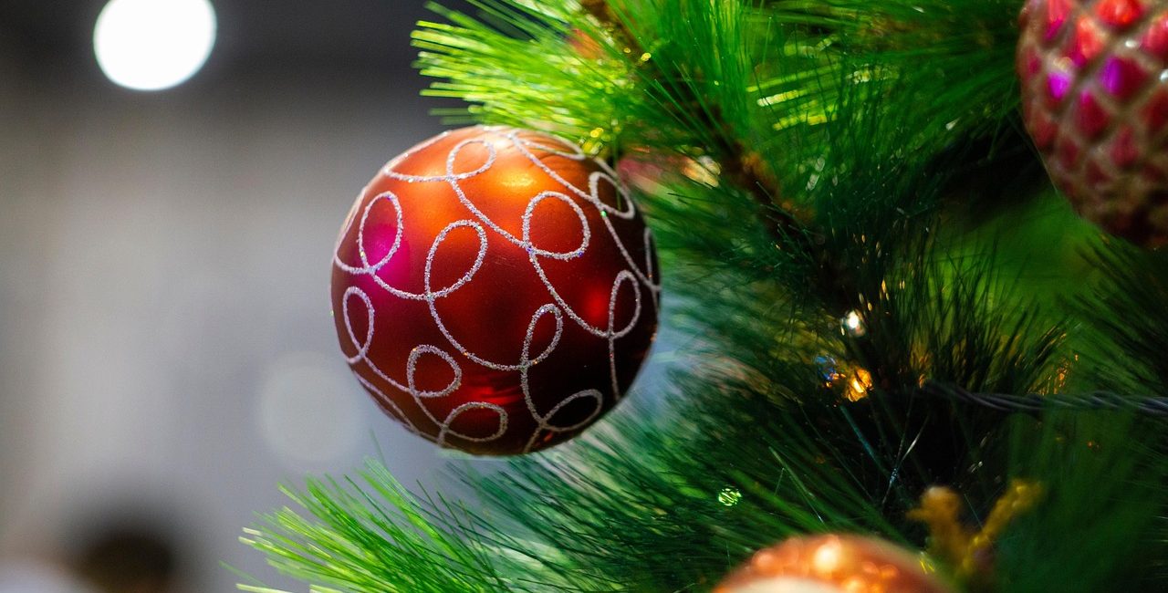 Christmas Tree baubles in red and gold on an artificial christmas tree