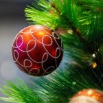 Christmas Tree baubles in red and gold on an artificial christmas tree