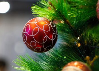 Christmas Tree baubles in red and gold on an artificial christmas tree