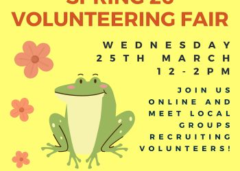 A happy green frog sitting with a few pink flowers on a vibrant light yellow background